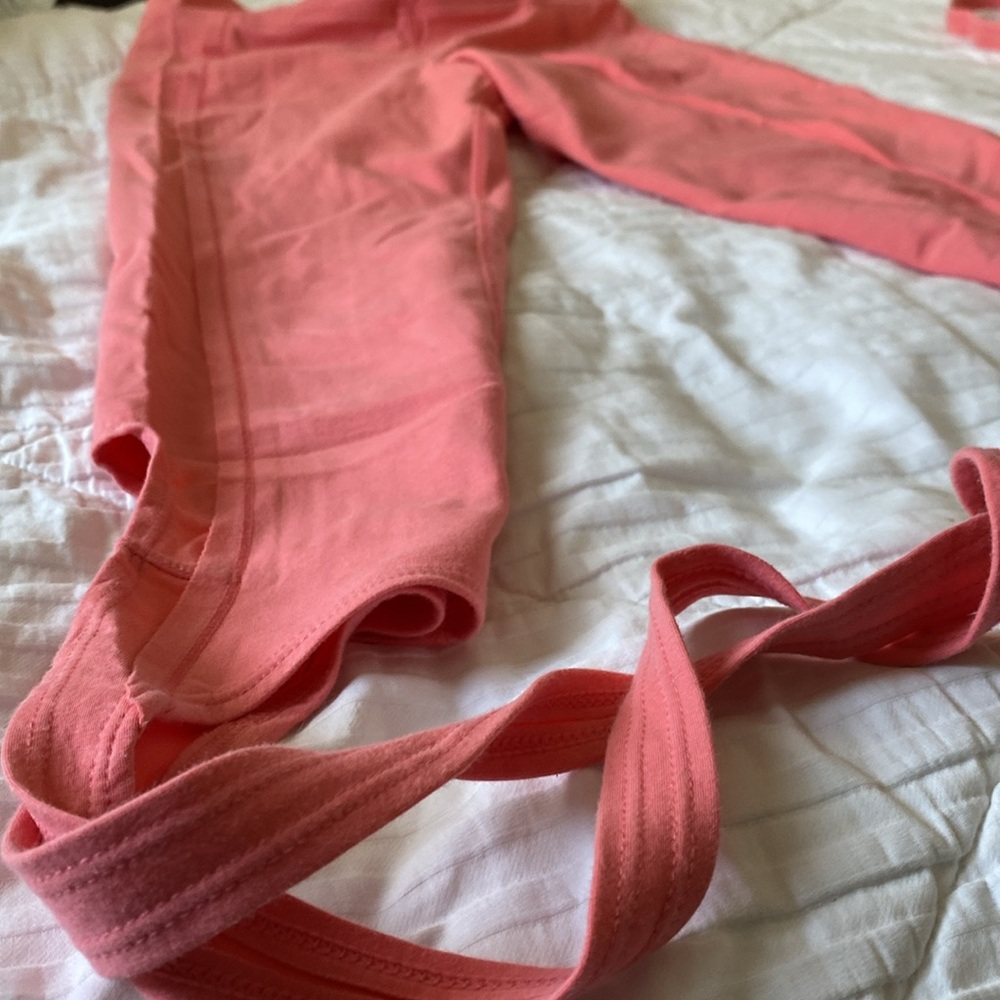 pink free people capri leggings in 3/4 length but with ties to tie around leg
